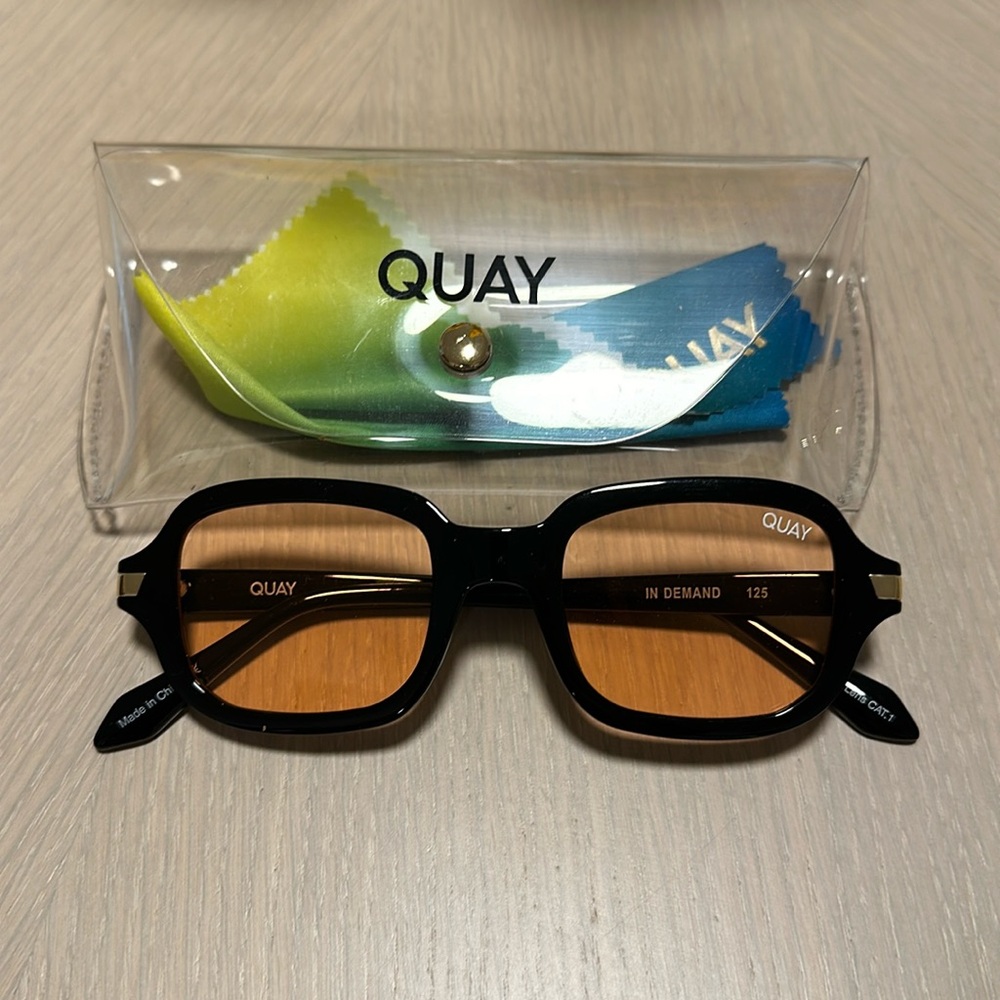 Quay Sunglasses. Orange lense with black frame.